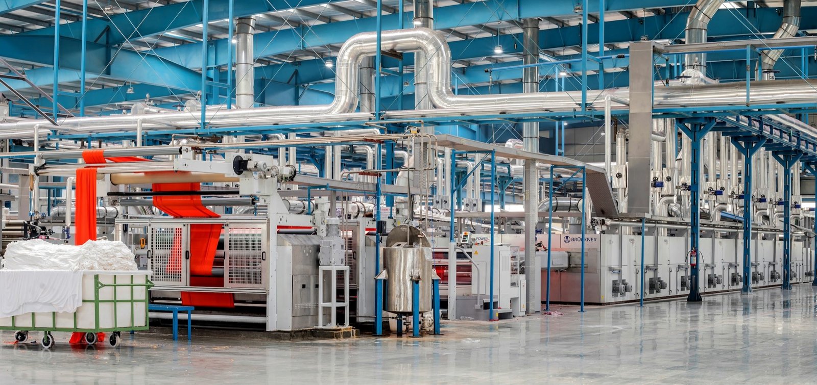 Industrial textile factory floor with weaving machinery