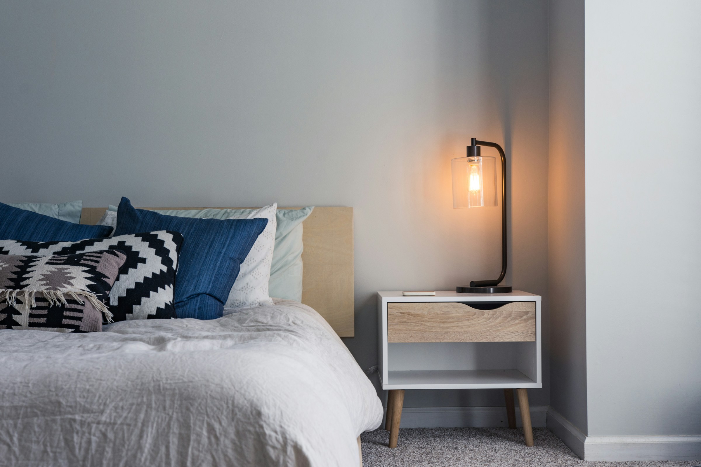 Folded linen textiles in warm ivory tones